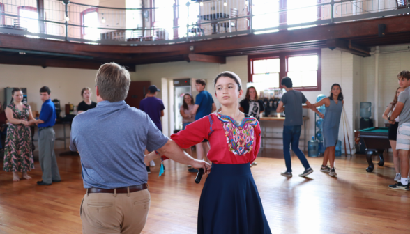 The dance instructors demonstrate a move called the "Broken Arm"