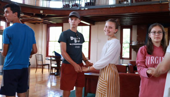 A pair of students in the swing position