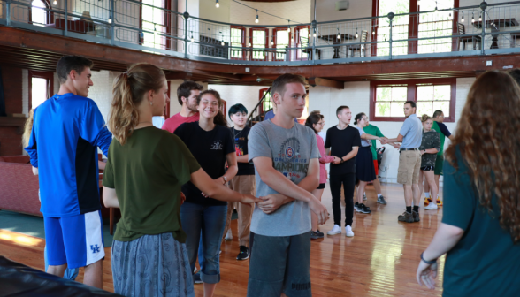 Students around the floor practicing moves