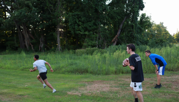 Students toss around a football