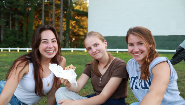 Three smile for the camera