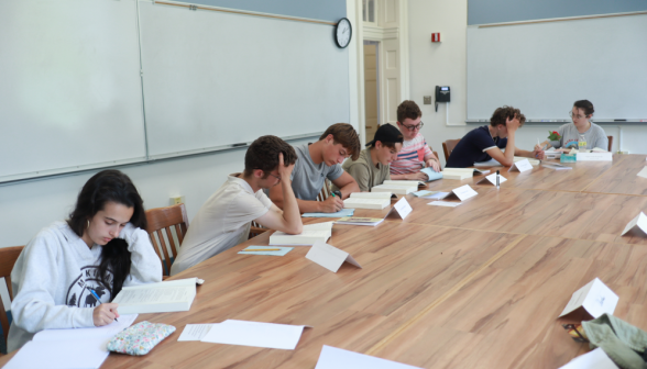 Students study at one of the classroom tables