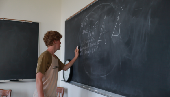 A student erases the board