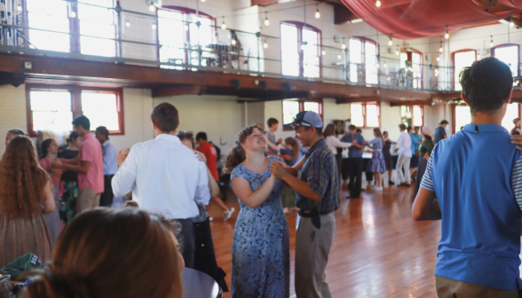 Students dancing around the floor