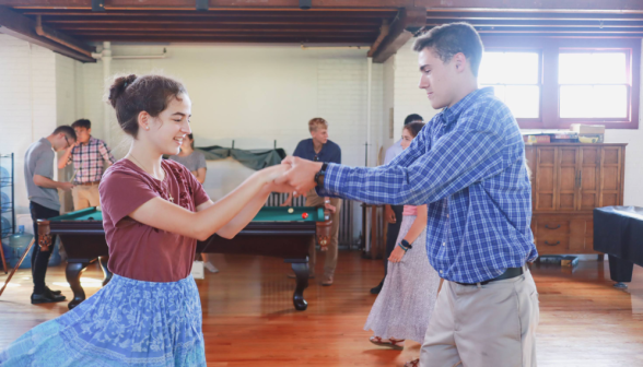 A pair of students dancing