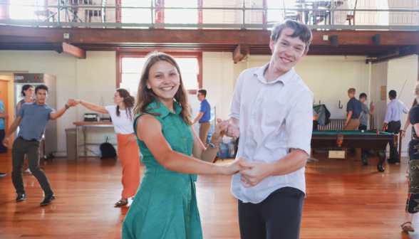 A student pair smiles for the camera