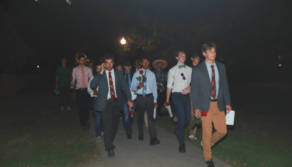 In jackets and ties, the men march toward the women's dorm