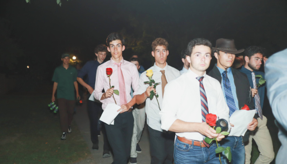 Another shot of the men, roses in hands