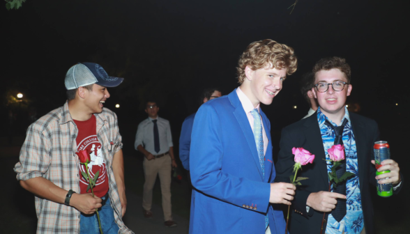 Three gentlemen smile for the camera