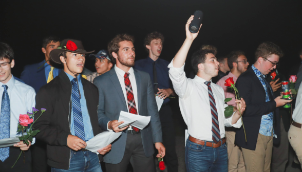 The men, singing with enthusiasm