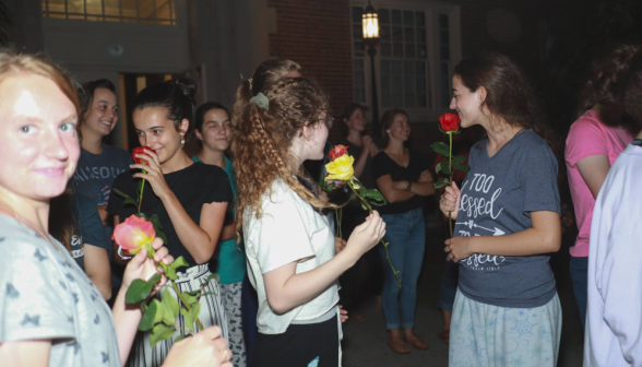 The women smell the roses