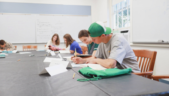 Students studying at the classroom table