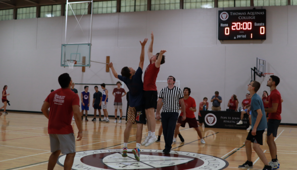 Intense competition for the ball near the center of the court