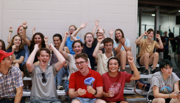 The spectators cheer and applaud