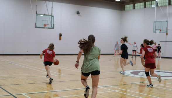 Students play basketball