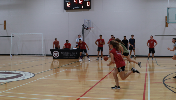 Students play basketball