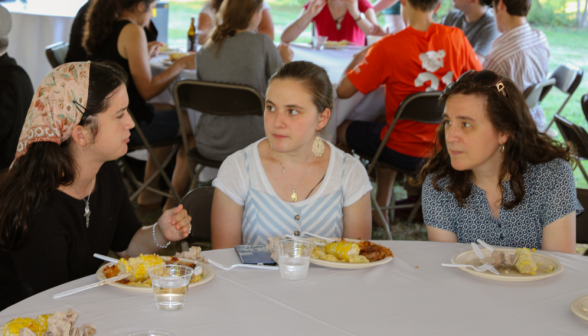 Three in discussion