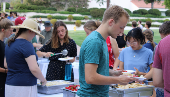 Another view of students serving themselves at the buffet