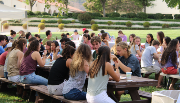 Another view of students eating at the tables