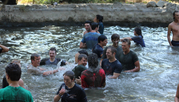 Students splash around in the pond