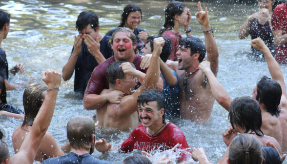 Cheering, hugging, and splashing in the pond