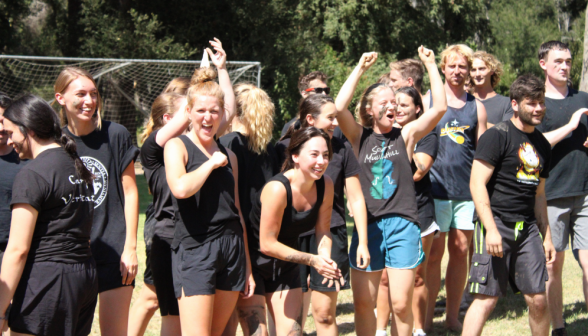 The black-clad team cheers