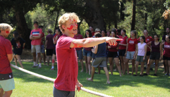 A member of red team shouts and points at something off-screen