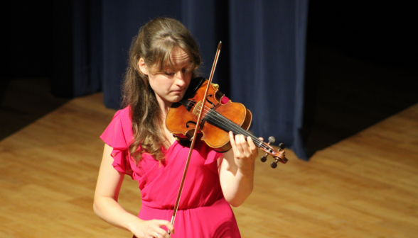 Another view of Greta performing on the violin