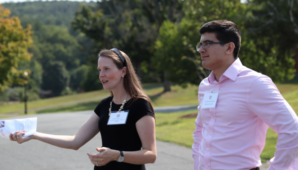 Admissions team members greet the incoming visitors