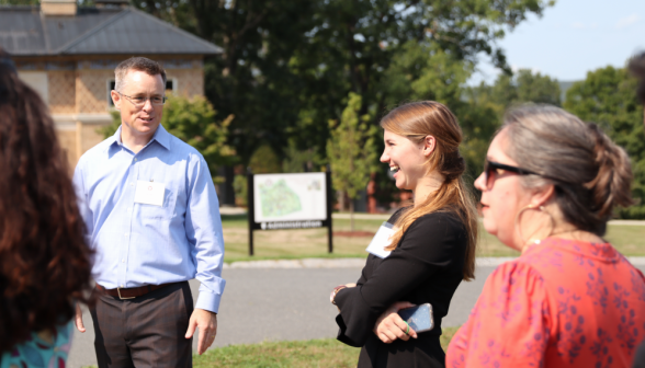 Admissions workers chat with the visitors