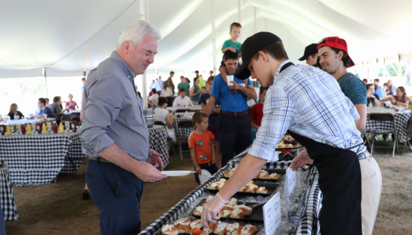 President O'Reilly selects a sandwich