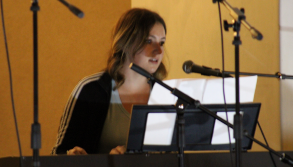 A student performs a piano piece