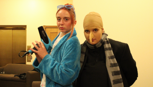 Two dressed as Gru and Lucy from Despicable Me