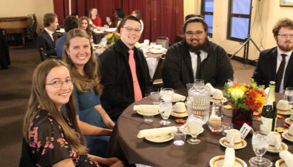 Another shot of the same table, with two more people in frame