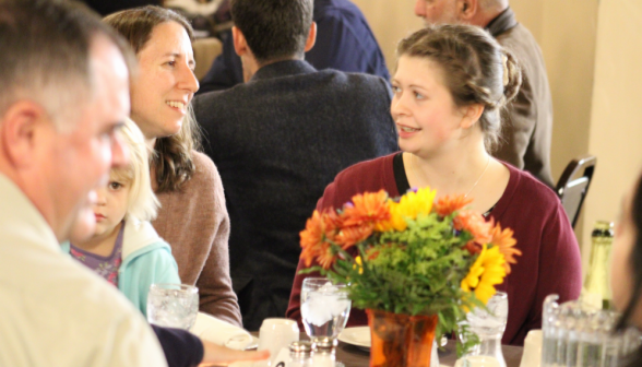 A conversation at one of the tables