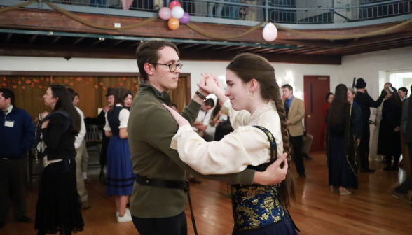 A pair of students dancing