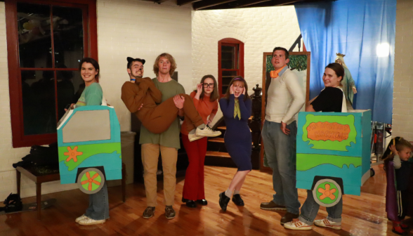 Seven dressed as the characters from Scooby Doo (two are dressed as the front and back halves of the Mystery Machine)
