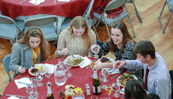 Four at a table enjoy the meal