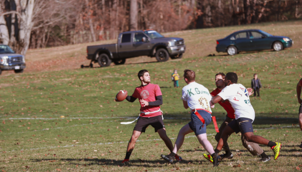 A student prepares to make a long pass