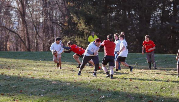 An upperclassman breaks through the line and sacks the QB!