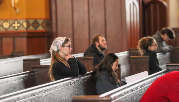 Students in the pews before the blessing