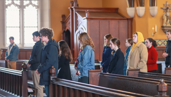 Students in line to kiss the relic