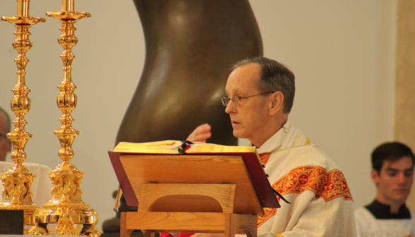 The priest incenses the altar