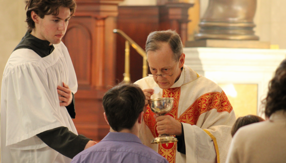 Fr. Brock gives out Communion