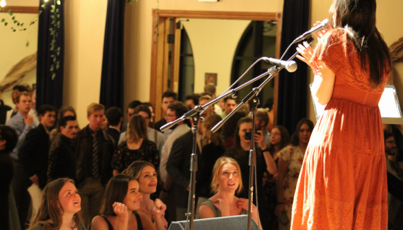 A singer performs for the assembly