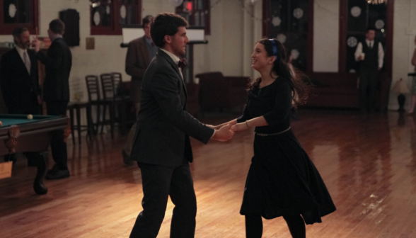 A student couple dances