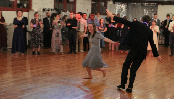 A student pair dances the foxtrot in front of the onlookers