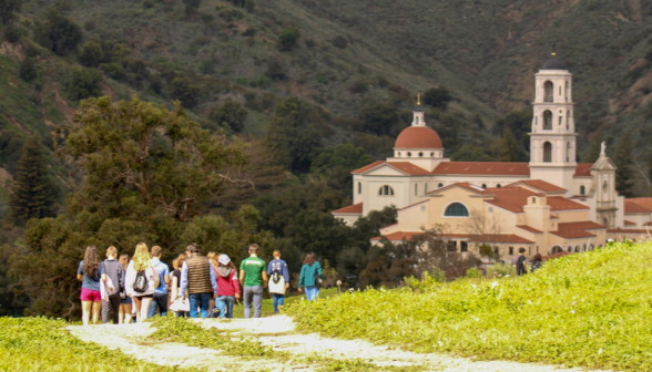 A group of students tours the campus environs