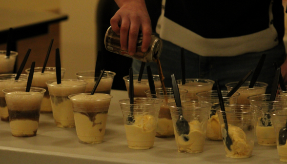 Pouring root beer floats