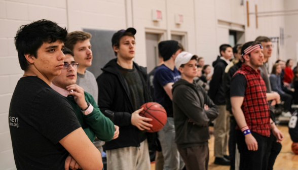 Onlookers at the edge of the gym